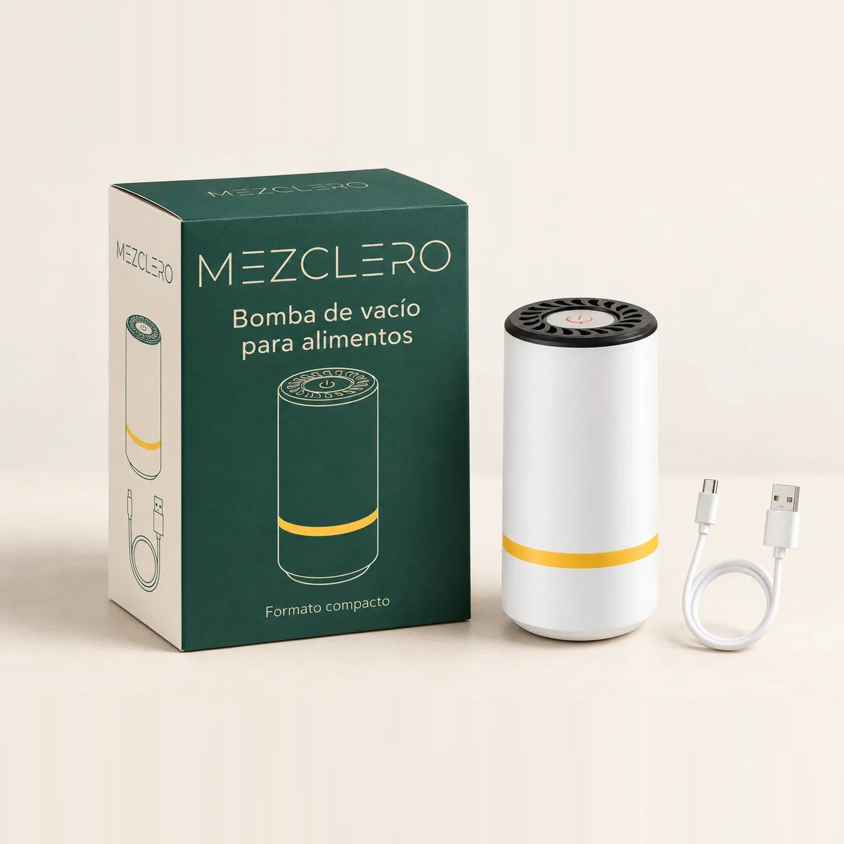 Bomba de vacío Mezclero blanca con tapa negra, junto a su caja verde y su cable USB.